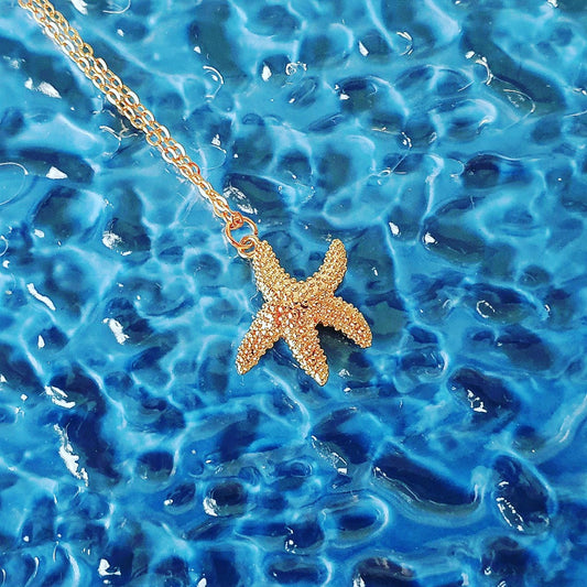 Sea star golden pendant